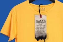 Yellow shirt with laundry slip "License to Greenwash"