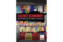 Title: Sachet Economy: Big Problems in Small Packets; Colorful toy-shop with plastic boxes